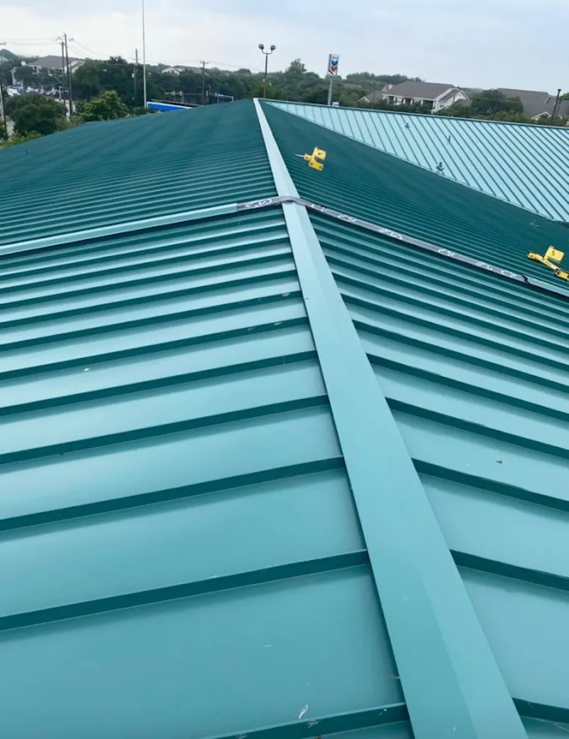 Green commercial metal roof ridge and valley for Metal Roof Repair in Durango