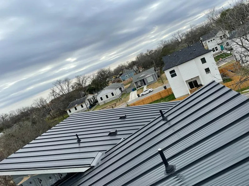 Standing seam metal roof panels with vents for Skylight Repair in Durango